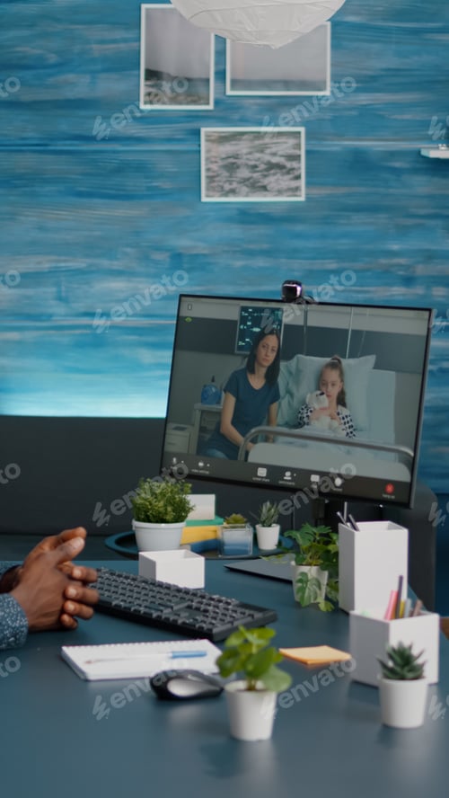 Preview: Black man talking with wife about kid health while they are lying in hospital ward