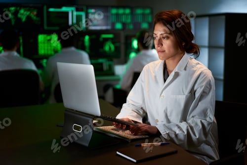 Preview: Medical Research Scientist Typing on His Desktop Computer in a Biological Applied Science Research