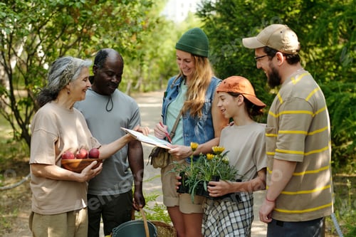 Preview: Multiethnic Group of Middle Aged and Young Adults Gardening Outdoors Together