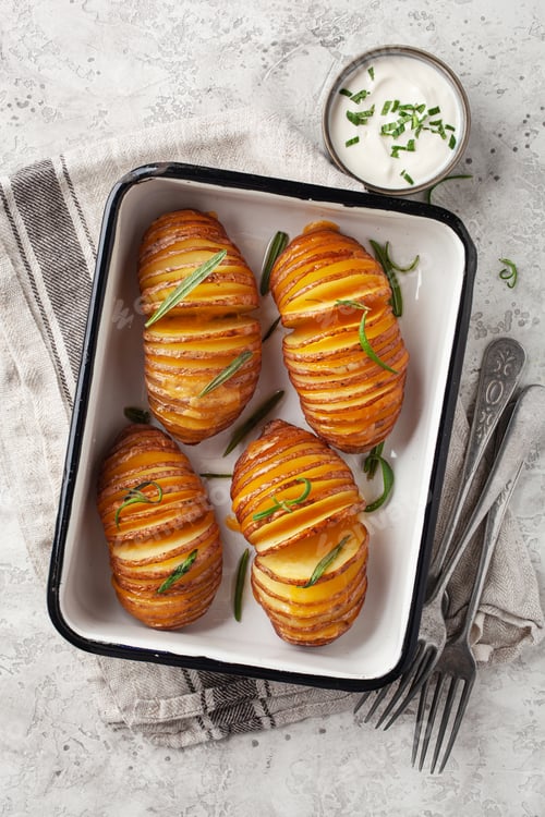Preview: baked hasselback potato with cheddar cheese and rosemary