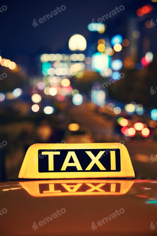 Preview: Taxi Sign Shines in a City at Night