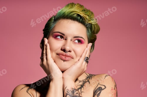 Preview: Vibrant young woman showcasing bold fashion and striking makeup against a pink backdrop