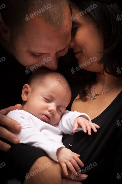 Preview: Happy Young Attractive Mixed Race Family with Newborn Baby.