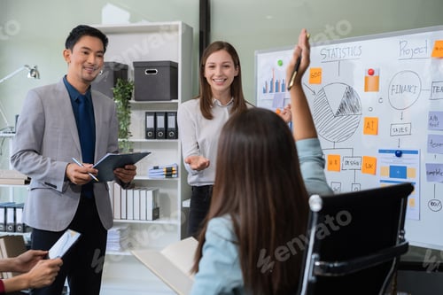 Preview: Group project manager negotiating in the boardroom at a meeting.