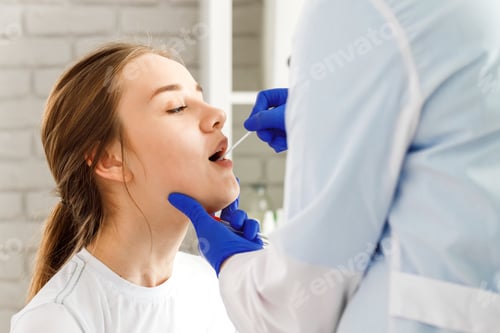 Preview: Doctor taking a throat swab from a patient woman