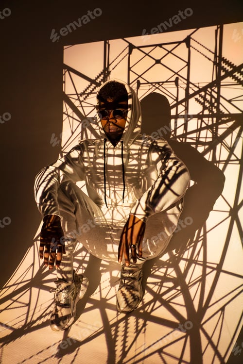 Preview: Black man dancing under bright light
