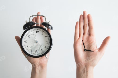 Preview: Hands holding a clock