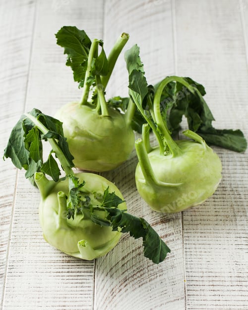 Preview: Fresh kohlrabi on a white wooden background. Healthy food, vegetables.