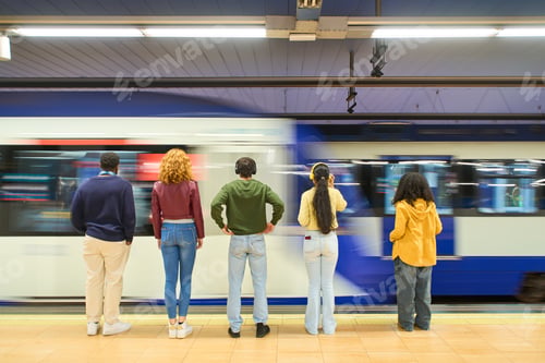 Preview: Young people waiting for arriving train in subway station