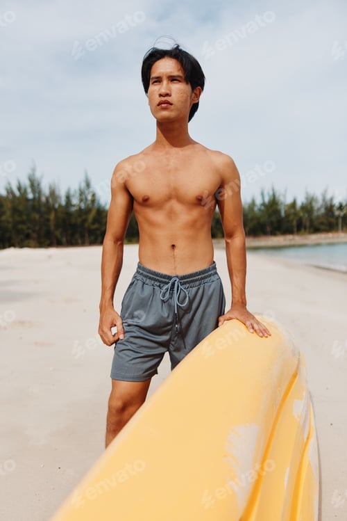 Preview: Happy Asian Man Kayaking in Tropical Paradise
