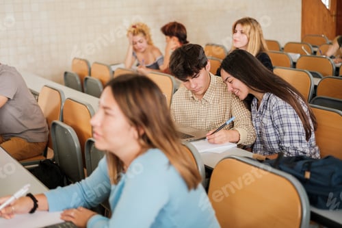 Preview: Group of university students in the classroom while the teacher gives the lesson