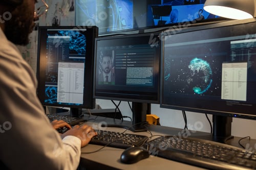 Preview: Young policeman entering personal data of suspect into computer database