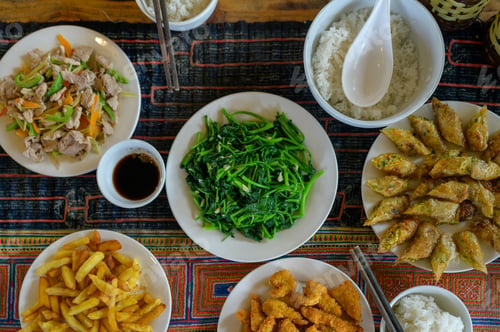 Preview: Vietnamese seaweed, shrimp, fried potato, soy sauce, rice, chopsticks, and spring rolls on table