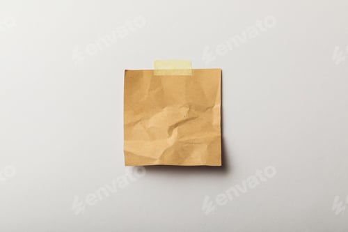 Preview: brown blank paper with sticky tape on white background