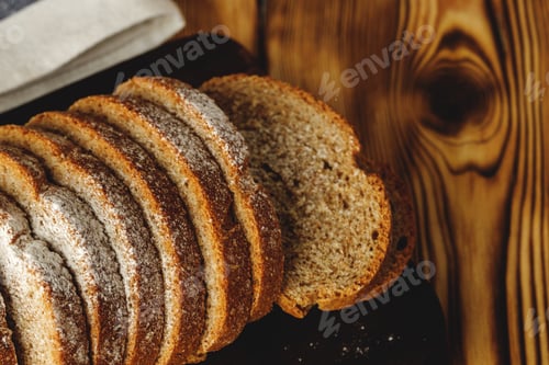 Preview: Sliced loaf of bread on wooden board