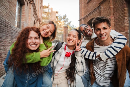 Preview: Diverse group of happy high school students posing outdoors, smiling and enjoying time together
