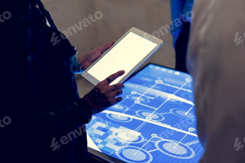 Preview: Hands holding using tablet at technology meeting