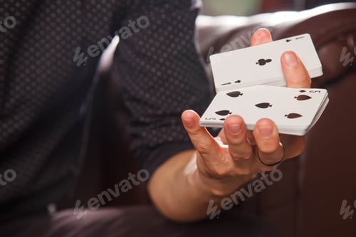 Preview: Clever hands of magician on black background