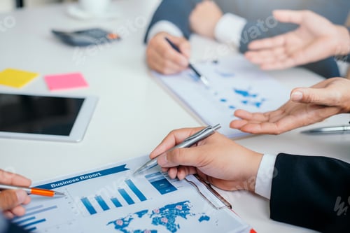 Preview: Business people discussion and summary financial information at meeting.