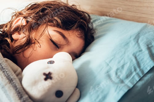 Preview: adorable little girl sleeping with her teddy bear