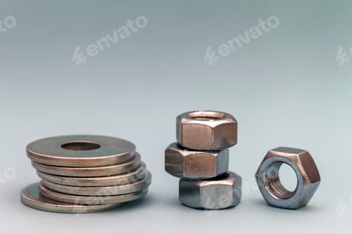 Preview: Joiner's accessories. Stacks of metal screw washers and nuts iso