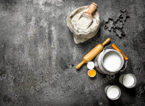 Preview: Baking background. Milk, flour and other ingredients for the dough.