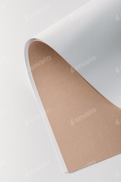 Preview: close-up view of white and brown rolled paper sheets on grey background