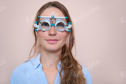 Preview: Charming woman is receiving qualified check up her eyesight with trial frame