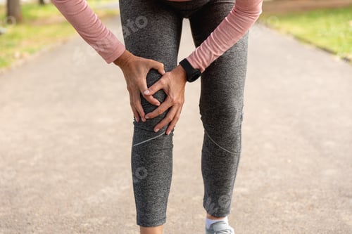 Preview: Exhausted jogger woman in the park
