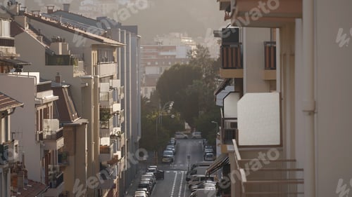 Preview: Empty no people narrow street in old center of the city. Action. Sunny street with parked cars and