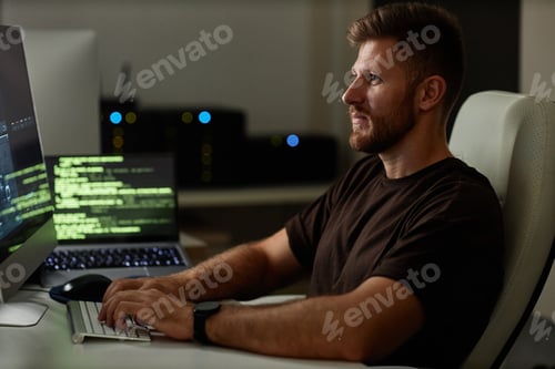 Preview: Computer Programmer Working at Night