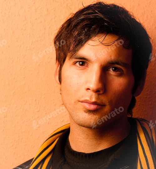 Preview: Portrait of a dark-haired young male with a serious facial expression