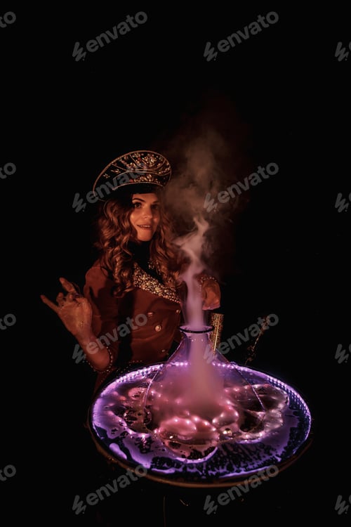 Preview: Woman magician illusionist of circus showing soap bubbles show on tabletop at black background