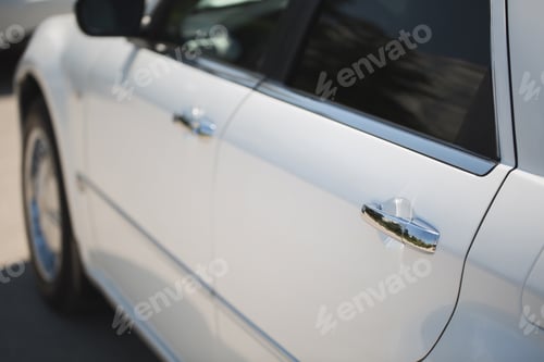 Preview: White Car with Silver Car Door Handle