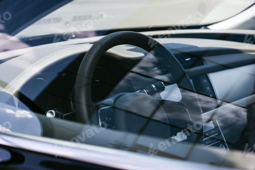 Preview: close up view of steering wheel on black car