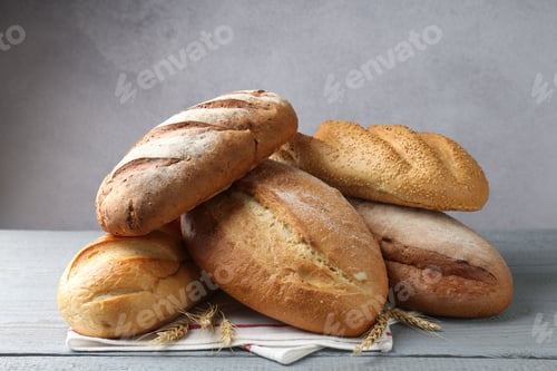 Preview: Many bread loaves on grey wooden table