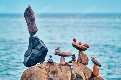 Preview: Concept of balance and harmony - pebble stone stacks on the beach