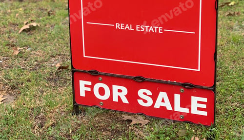 Preview: Red Real Estate For Sale sign at a neighborhood home.