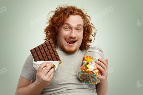 Preview: Portrait of happy plump young redhead bearded man looking at camera with cheerful expression, sticki