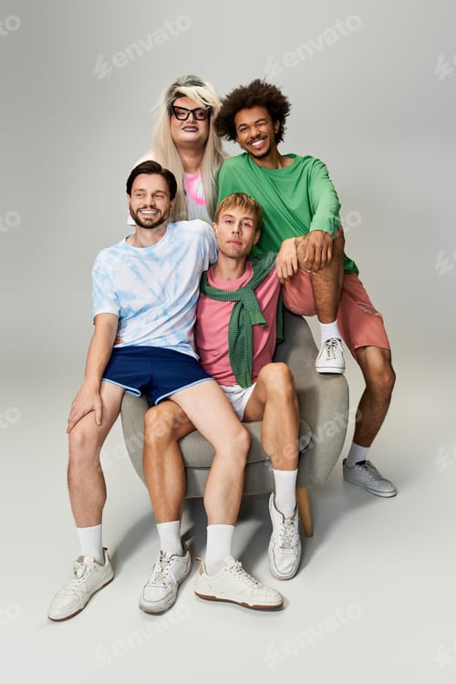 Preview: Group of friends celebrating vibrant queer culture while posing joyfully for a studio portrait