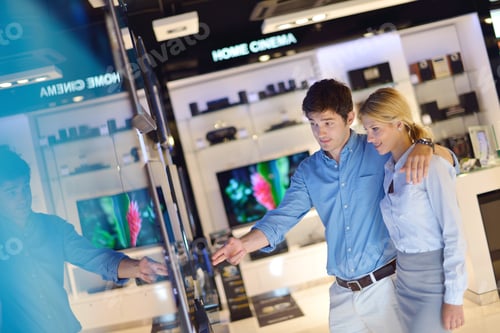 Preview: People In Consumer Electronics Retail Store Looking At Latest Laptop, Television And Photo Camera