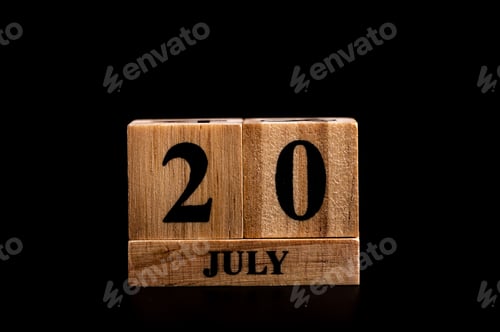 Preview: wooden calendar 20 July word on black background with copy space , selective focus at the calendar