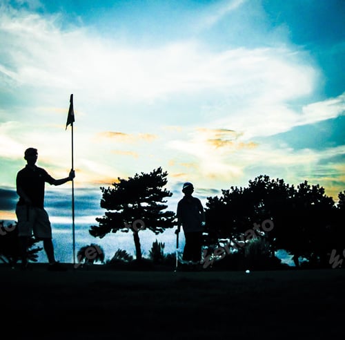 Preview: Silhouette of father and son playing golf
