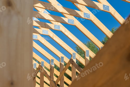 Preview: Construction of a Wooden Roof Framework Under Clear Blue Skies