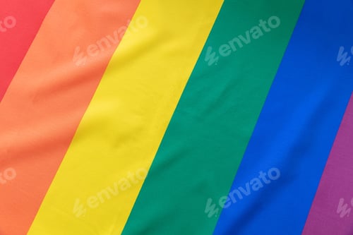 Preview: Rainbow flag, LGBT Gay pride symbol background texture, overhead. LGBTQ community rights