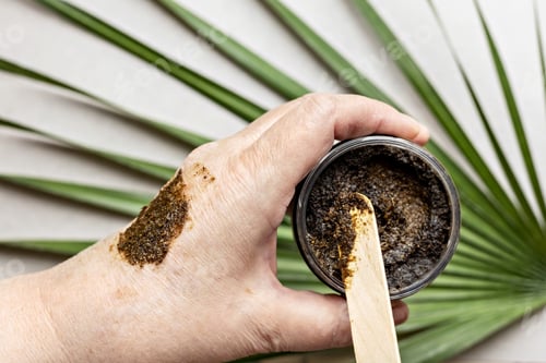 Preview: In a woman's hand is a jar with a Body Scrub made from natural ingredients. Handmade cosmetics.