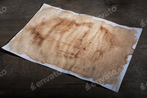Preview: Sheet Of Paper With The Effect Of Aging On Dark Wooden Background.