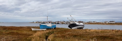 Preview: Scenic view on the small town on the Atlantic Ocean shore with boats parked onshore