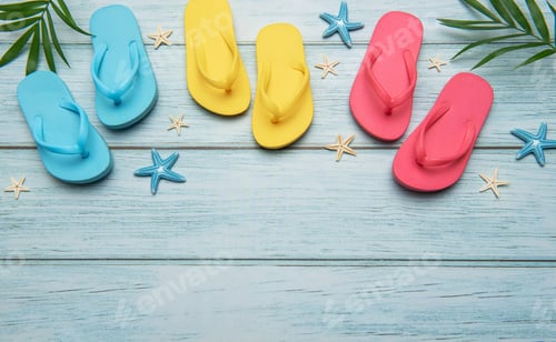 Preview: Flip Flops and Starfish on Beach Wood Background