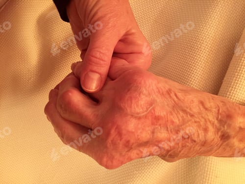 Preview: Elderly woman hand holding daughter’s hand